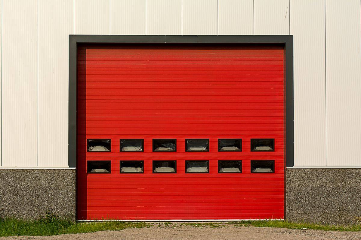 A heavy-duty industrial roller shutter on a factory loading bay