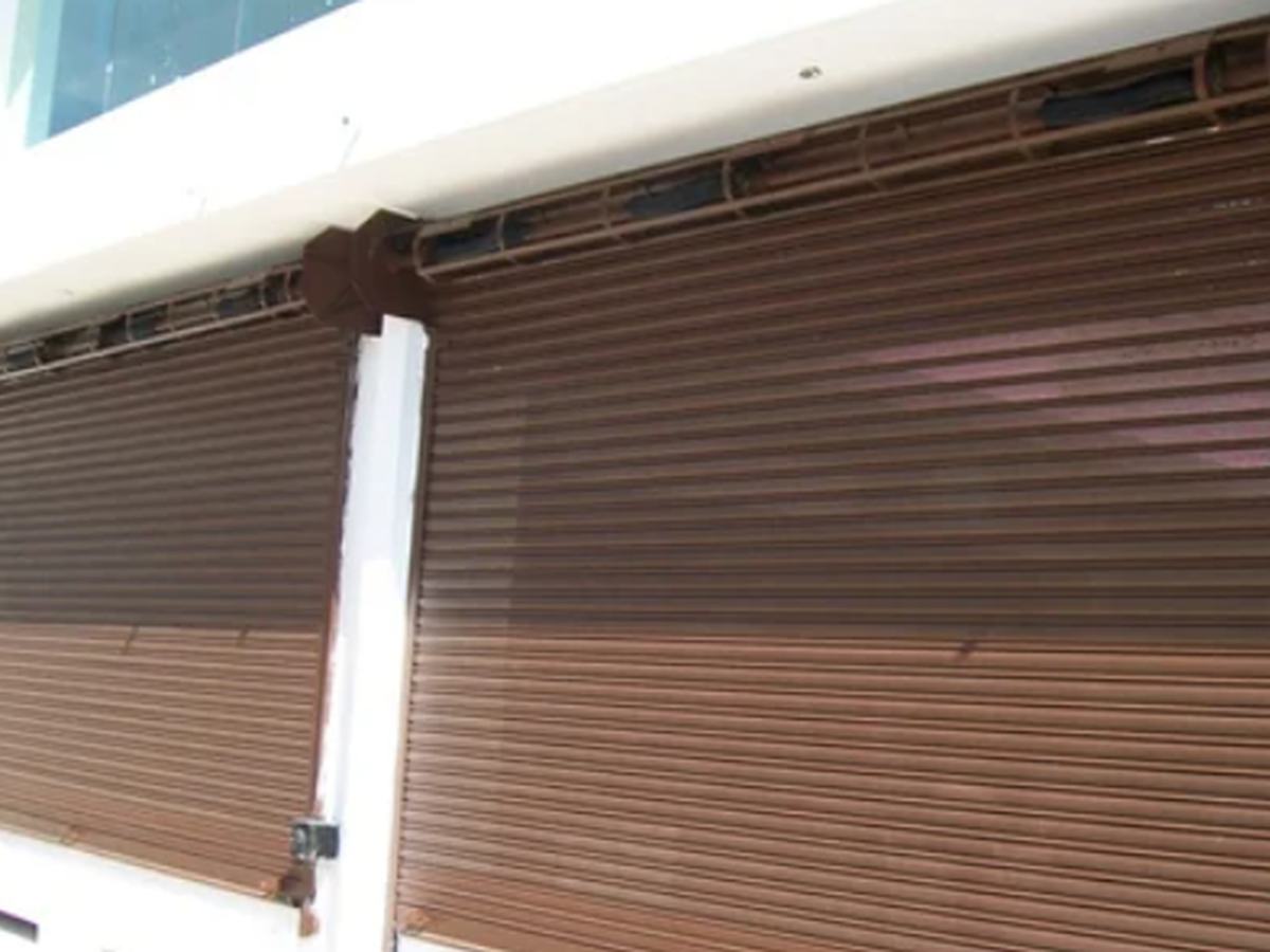 Bronze-finish gear-operated rolling shutter, closed