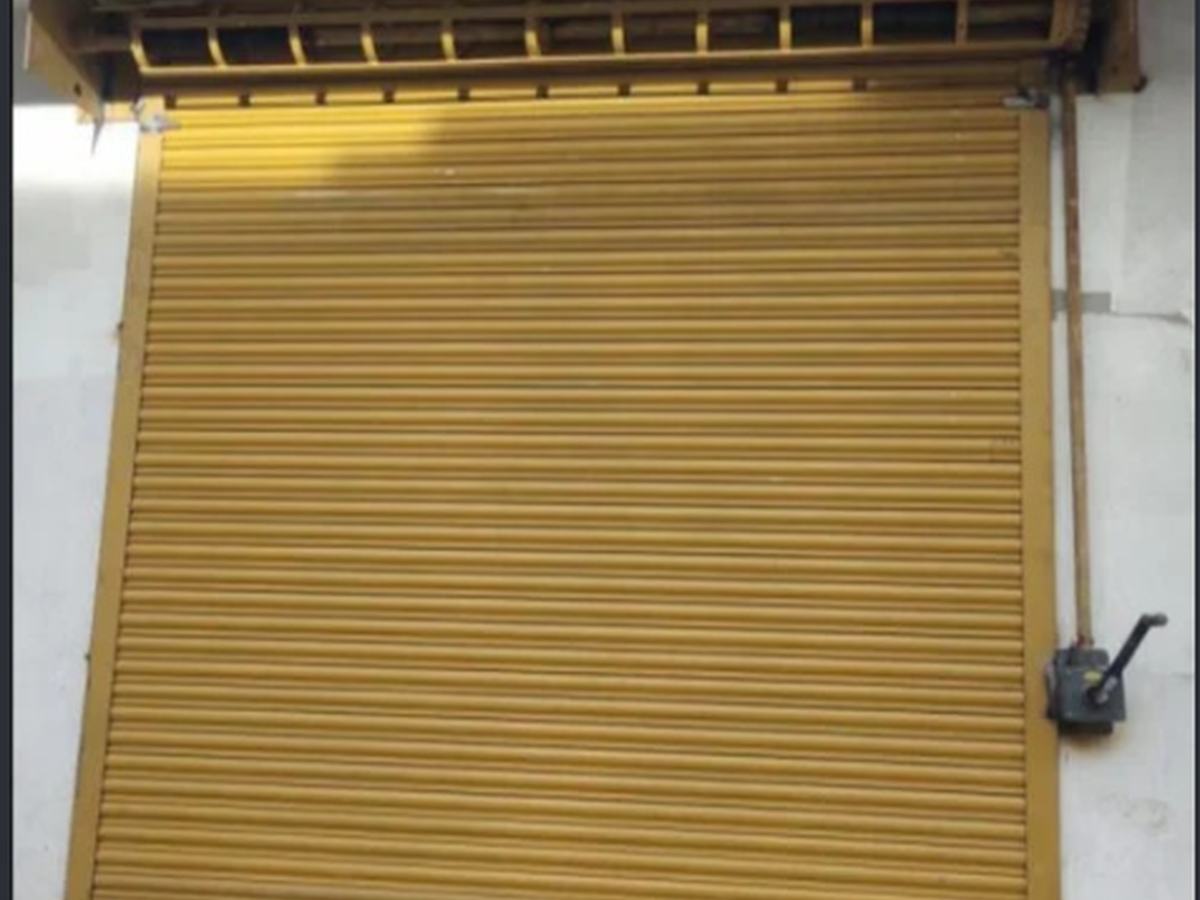 Gold-finish gear-operated rolling shutter, closed